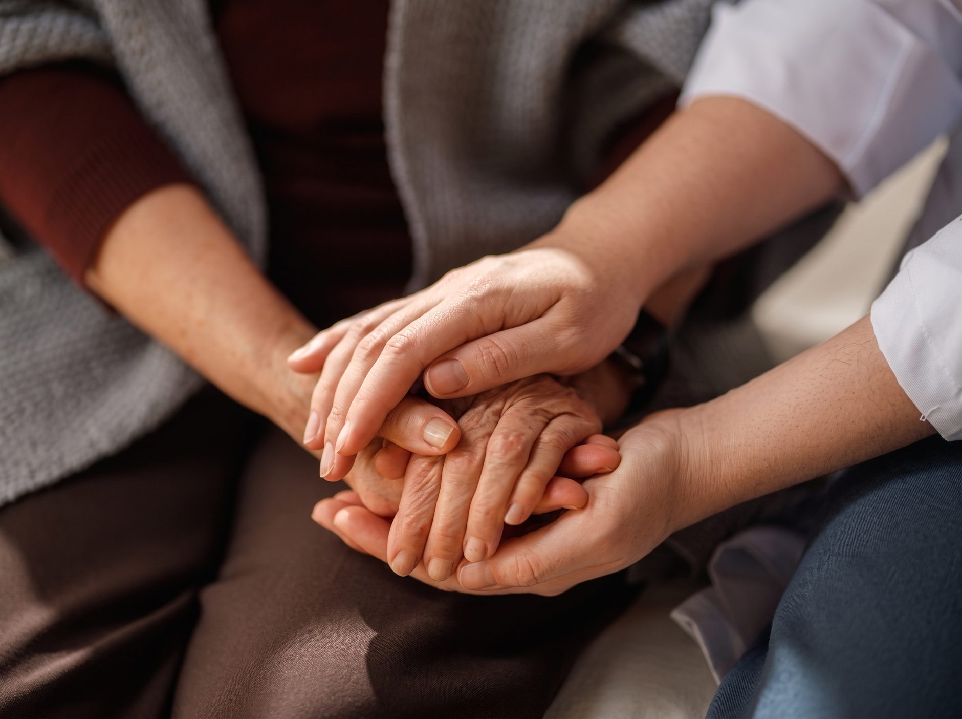 Caregiver holding a client's hands